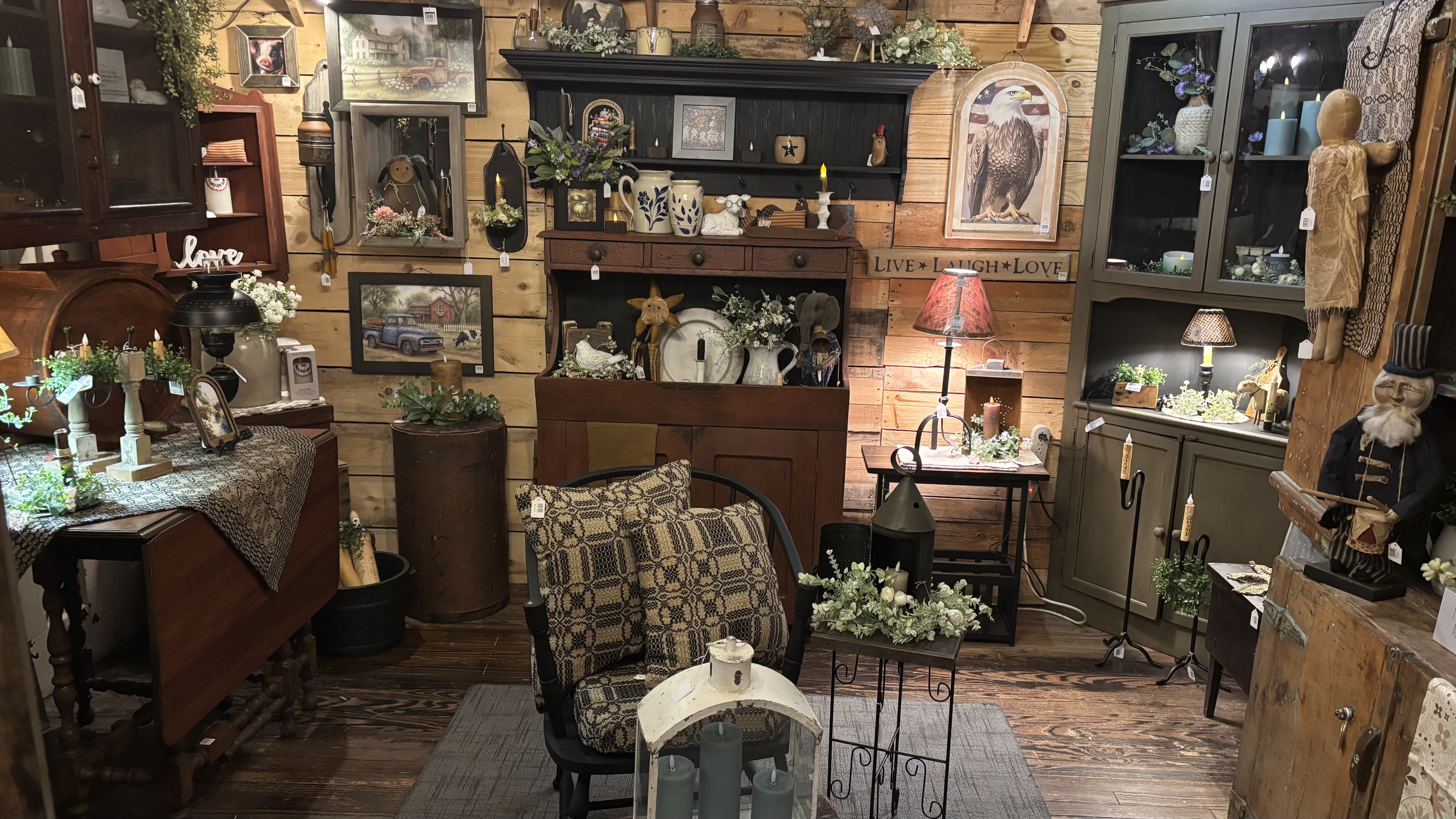 Rustic room vignette with candles and wooden hutch